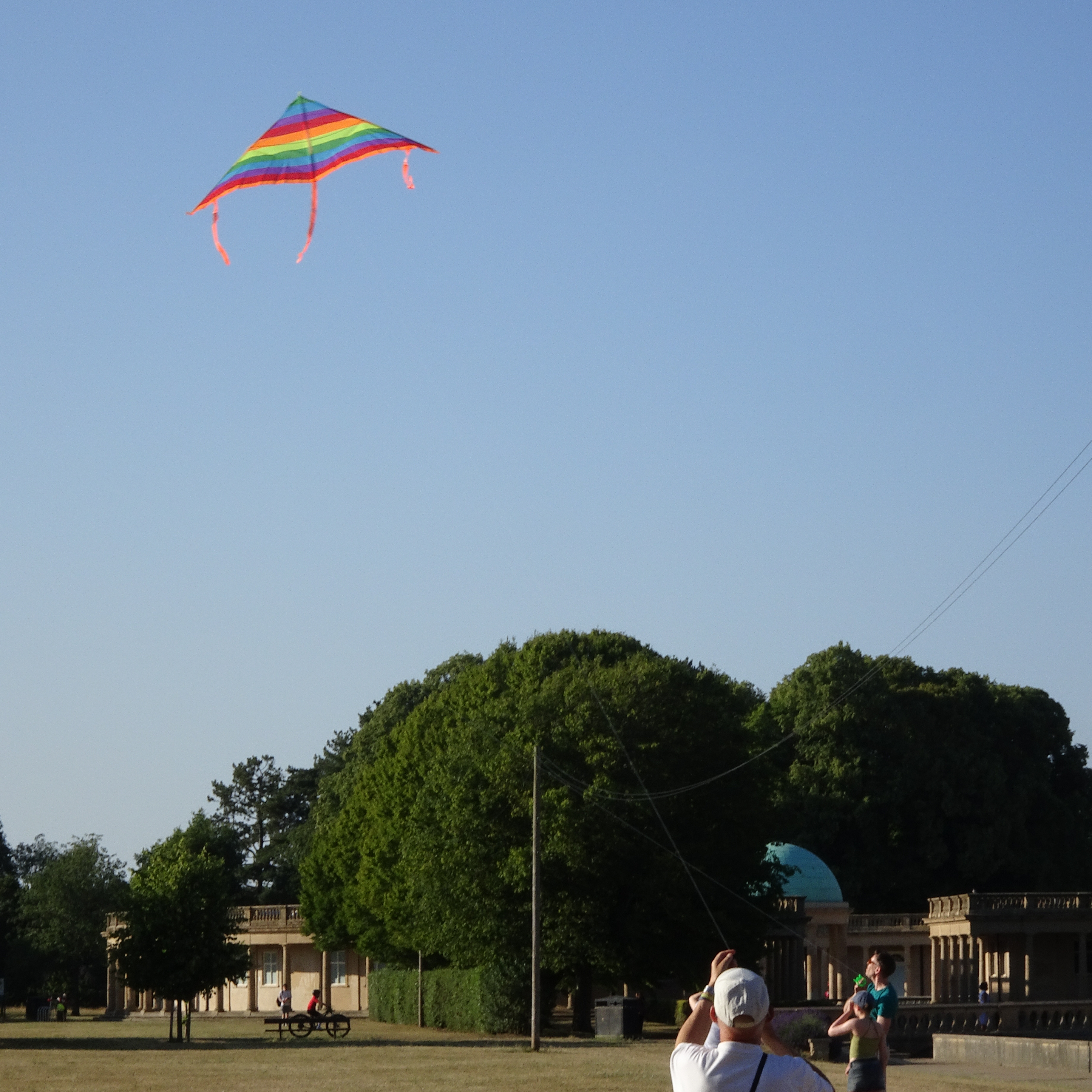 A rainbow kite gets launched.