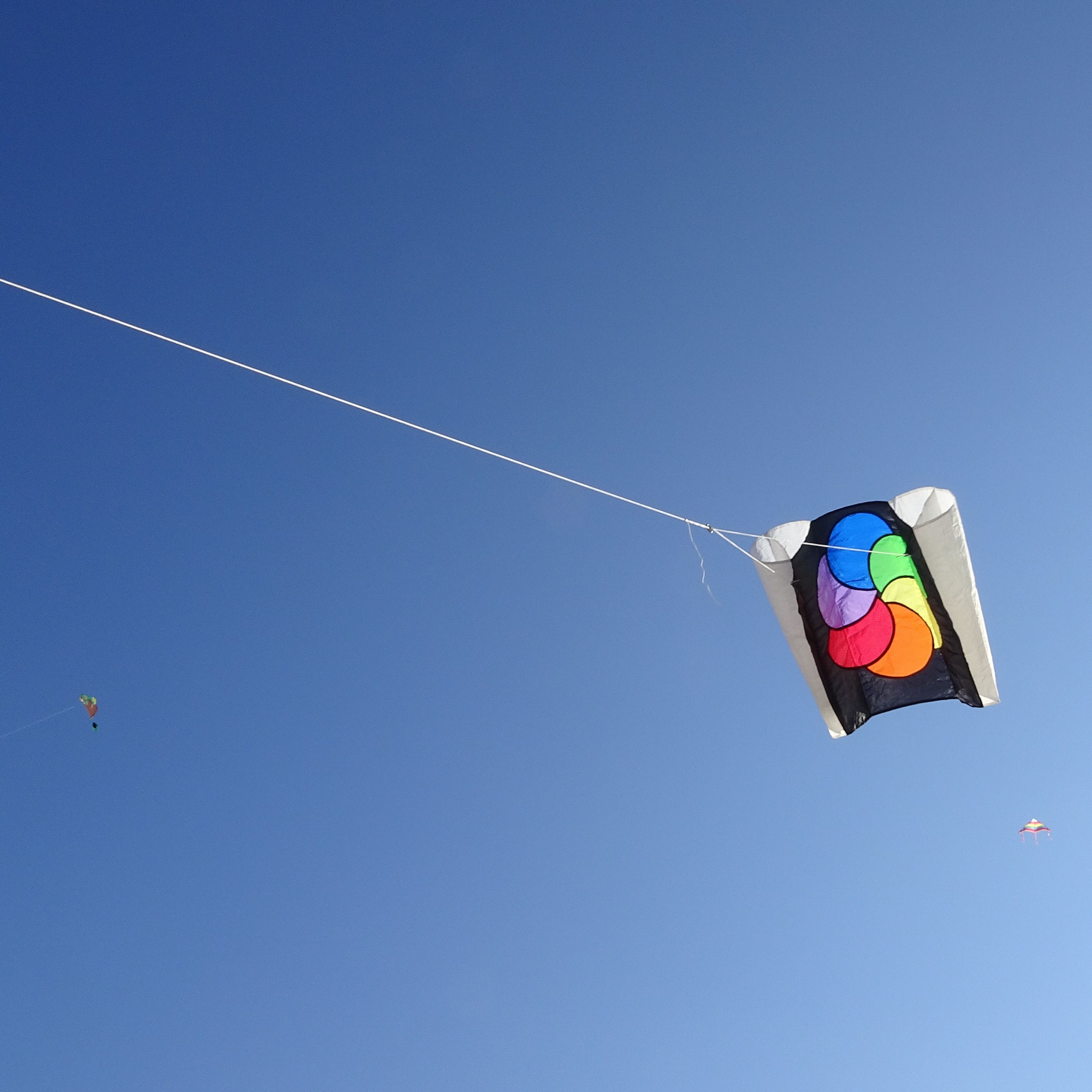 A parasled kit in the sky, with others higher!